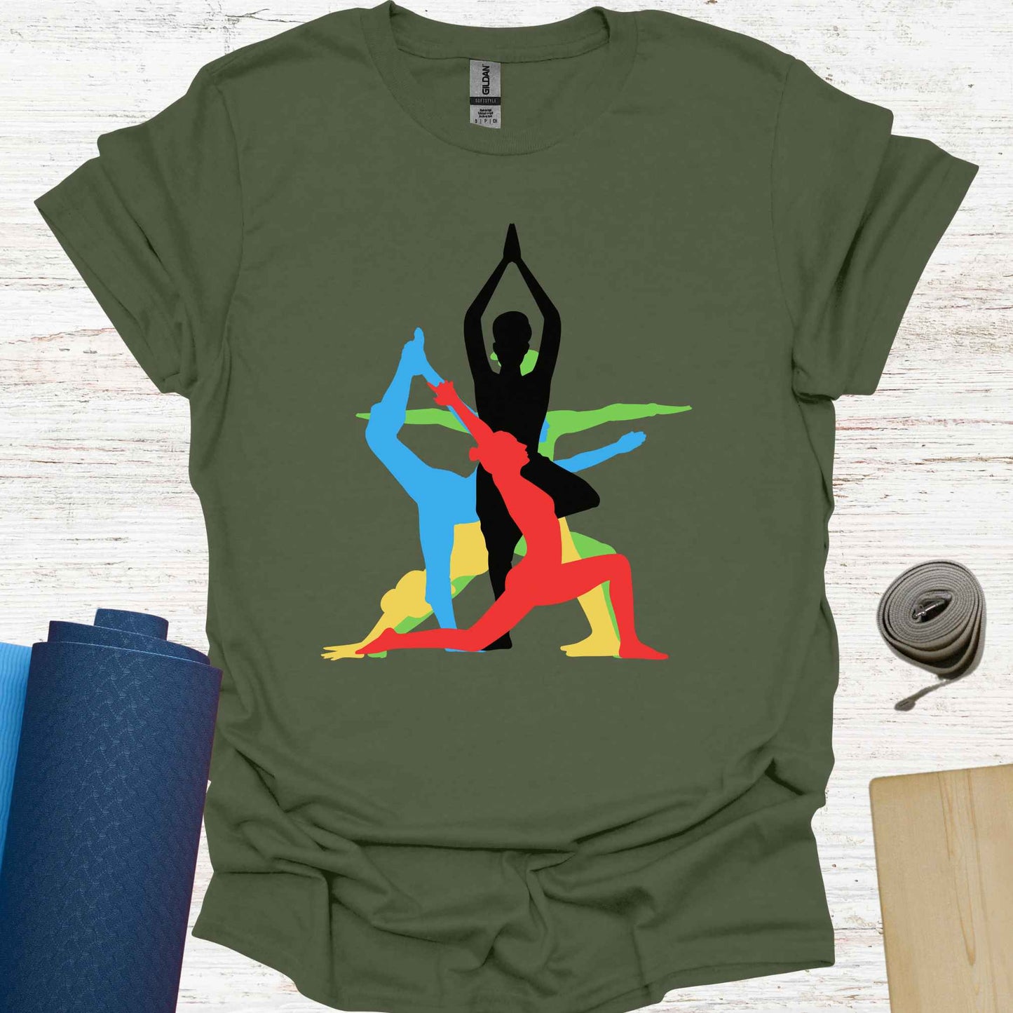 Military green t-shirt featuring a vibrant graphic of a human form in various overlapping yoga asanas, rendered in different colors. This design captures the fluidity and diversity of yoga, making it a perfect fit for yoga lovers and practitioners who embrace movement, mindfulness, and inner balance.