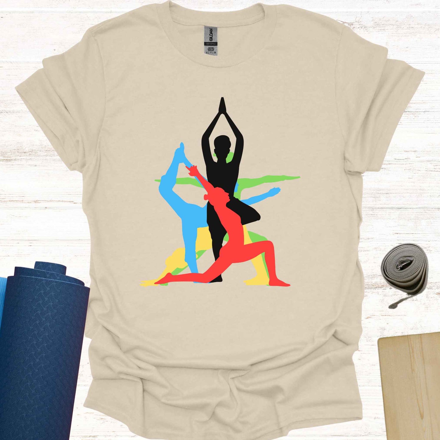 Beige t-shirt featuring a vibrant graphic of a human form in various overlapping yoga asanas, rendered in different colors. This design captures the fluidity and diversity of yoga, making it a perfect fit for yoga lovers and practitioners who embrace movement, mindfulness, and inner balance.