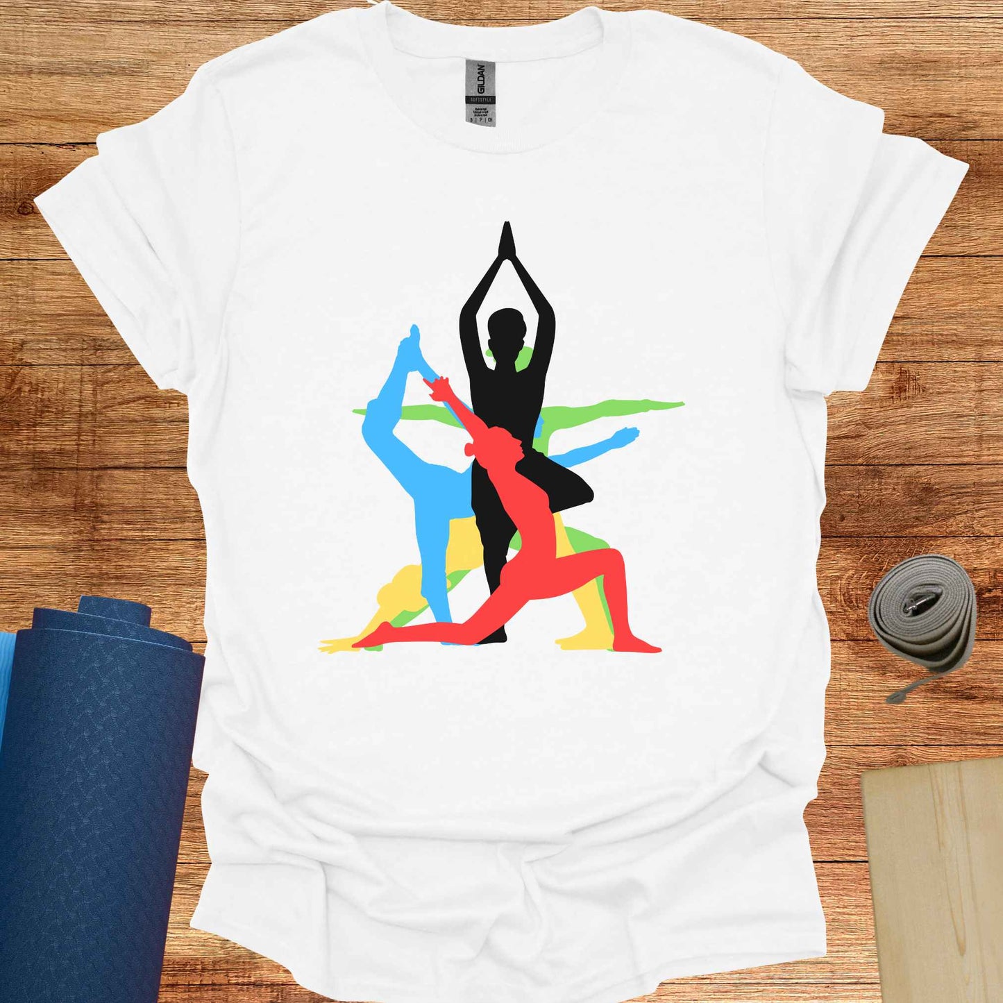 White t-shirt featuring a vibrant graphic of a human form in various overlapping yoga asanas, rendered in different colors. This design captures the fluidity and diversity of yoga, making it a perfect fit for yoga lovers and practitioners who embrace movement, mindfulness, and inner balance.