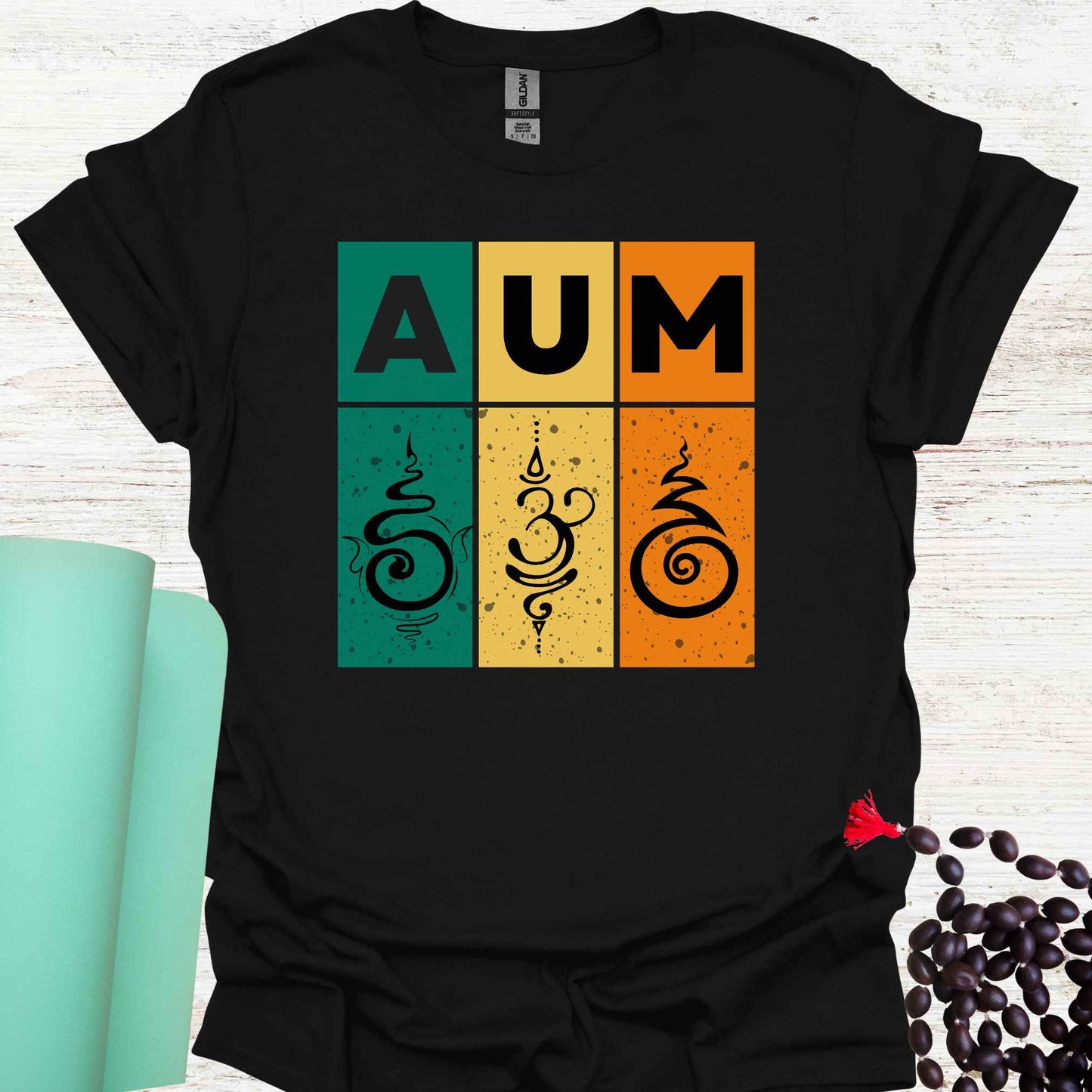 Black t-shirt with retro sunset-style design with green, yellow, and red bars, bold 'AUM' text, and Sanskrit symbols. Represents the sacred sound AUM, unity, and spiritual essence. The retro aesthetic merges timeless spirituality with modern design, appealing to those who practice meditation, yoga, or seek deeper spiritual awareness.
