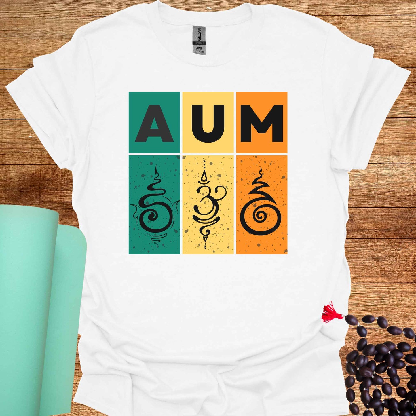 White t-shirt with retro sunset-style design with green, yellow, and red bars, bold 'AUM' text, and Sanskrit symbols. Represents the sacred sound AUM, unity, and spiritual essence. The retro aesthetic merges timeless spirituality with modern design, appealing to those who practice meditation, yoga, or seek deeper spiritual awareness.