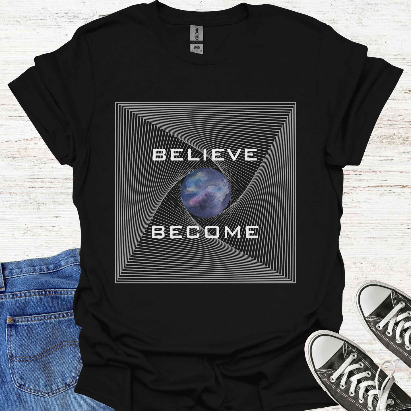 Black t-shirt featuring an abstract fractal design with a watercolor Earth graphic at the center, accompanied by the phrase 'Believe, Become.' This design symbolizes personal growth, transformation, and the connection between belief and action. The fractal pattern reflects the interconnectedness of all things, while the Earth graphic evokes a sense of global unity and harmony.