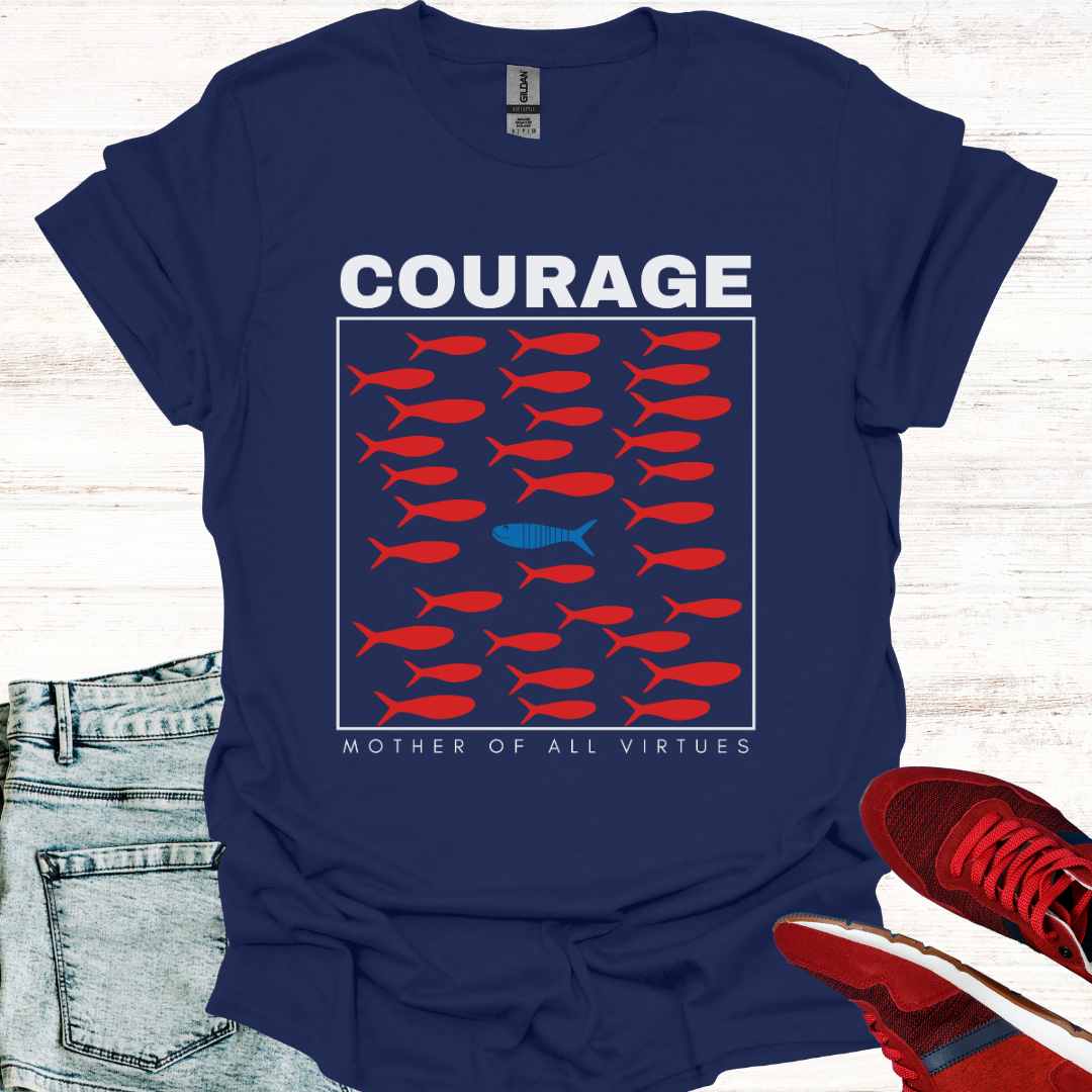 Navy blue t-shirt featuring a design of red fish swimming, with a sole blue fish swimming against the current, symbolizing individuality, perseverance, and the courage to defy societal norms. It is accompanied by the phrase: Courage: Mother of All Virtues. This design is a powerful representation of strength in following your own unique path, even when it means going against the flow. Perfect for those who value independence, resilience, and self-discovery.