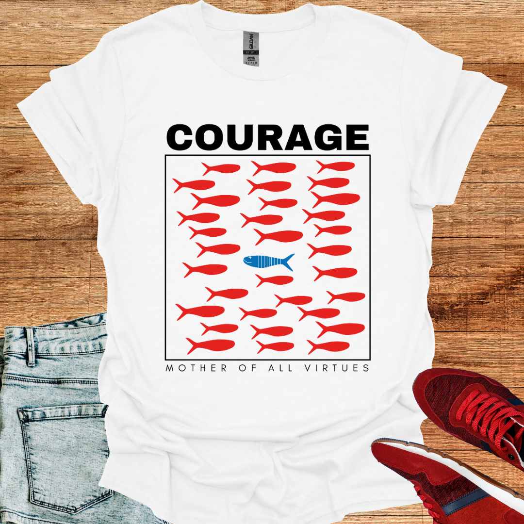 White t-shirt featuring a design of red fish swimming, with a sole blue fish swimming against the current, symbolizing individuality, perseverance, and the courage to defy societal norms. It is accompanied by the phrase: Courage: Mother of All Virtues. This design is a powerful representation of strength in following your own unique path, even when it means going against the flow. Perfect for those who value independence, resilience, and self-discovery.