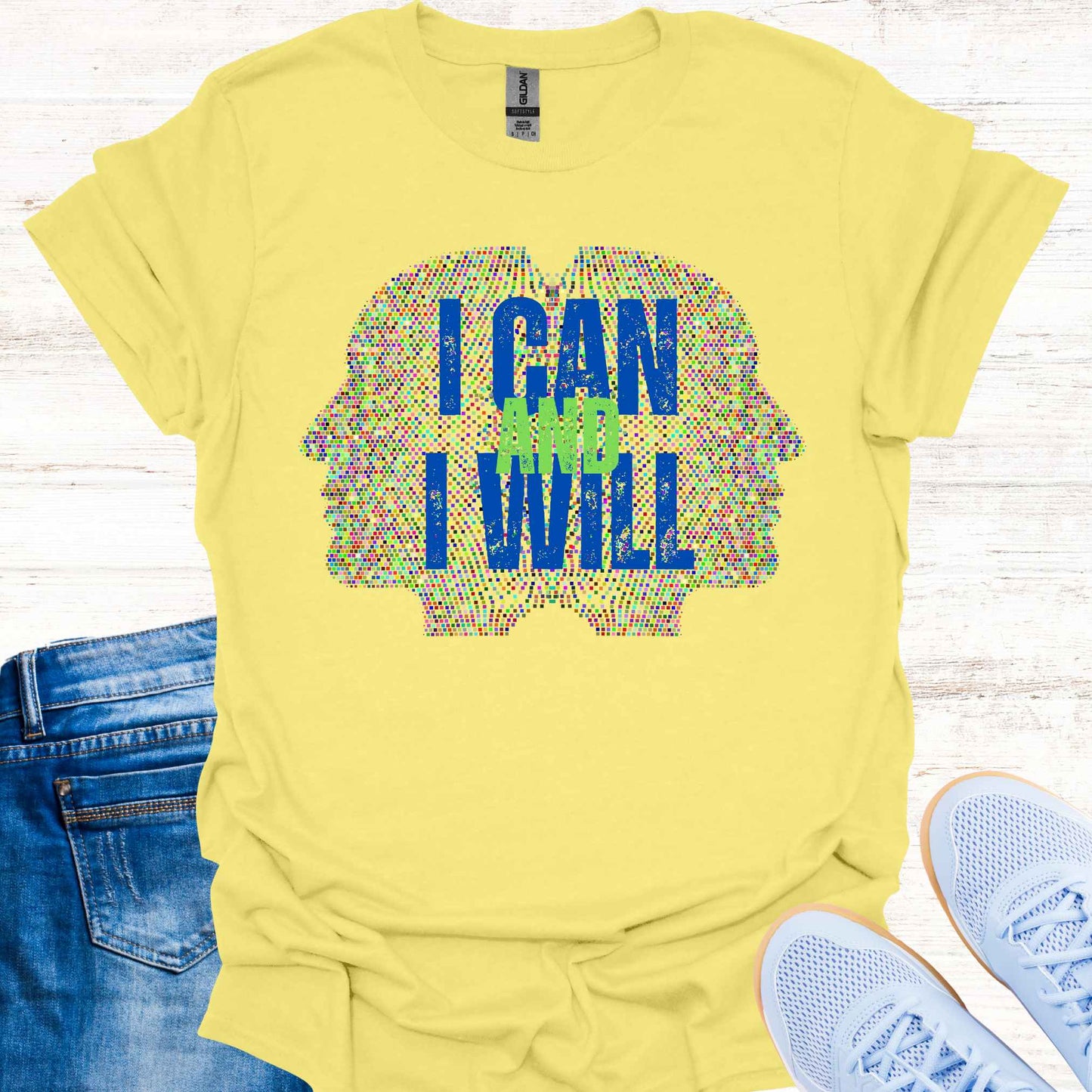 Yellow t-shirt featuring a graphic of two side profiles of faces composed of many small dots, accompanied by the empowering phrase 'I Can and I Will.' This design inspires confidence, positivity, and self-belief, encouraging wearers to overcome challenges and embrace determination. Perfect for individuals seeking motivation and a reminder of their inner strength.