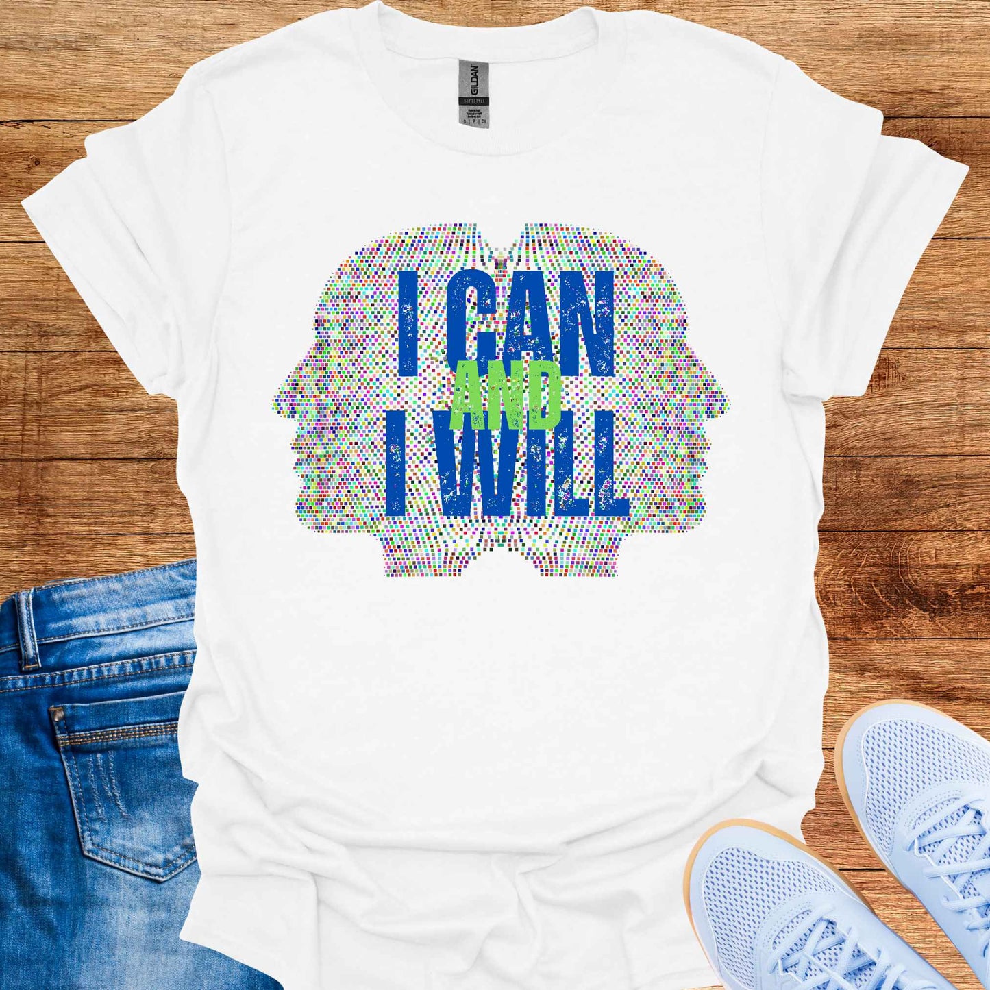 White t-shirt featuring a graphic of two side profiles of faces composed of many small dots, accompanied by the empowering phrase 'I Can and I Will.' This design inspires confidence, positivity, and self-belief, encouraging wearers to overcome challenges and embrace determination. Perfect for individuals seeking motivation and a reminder of their inner strength.