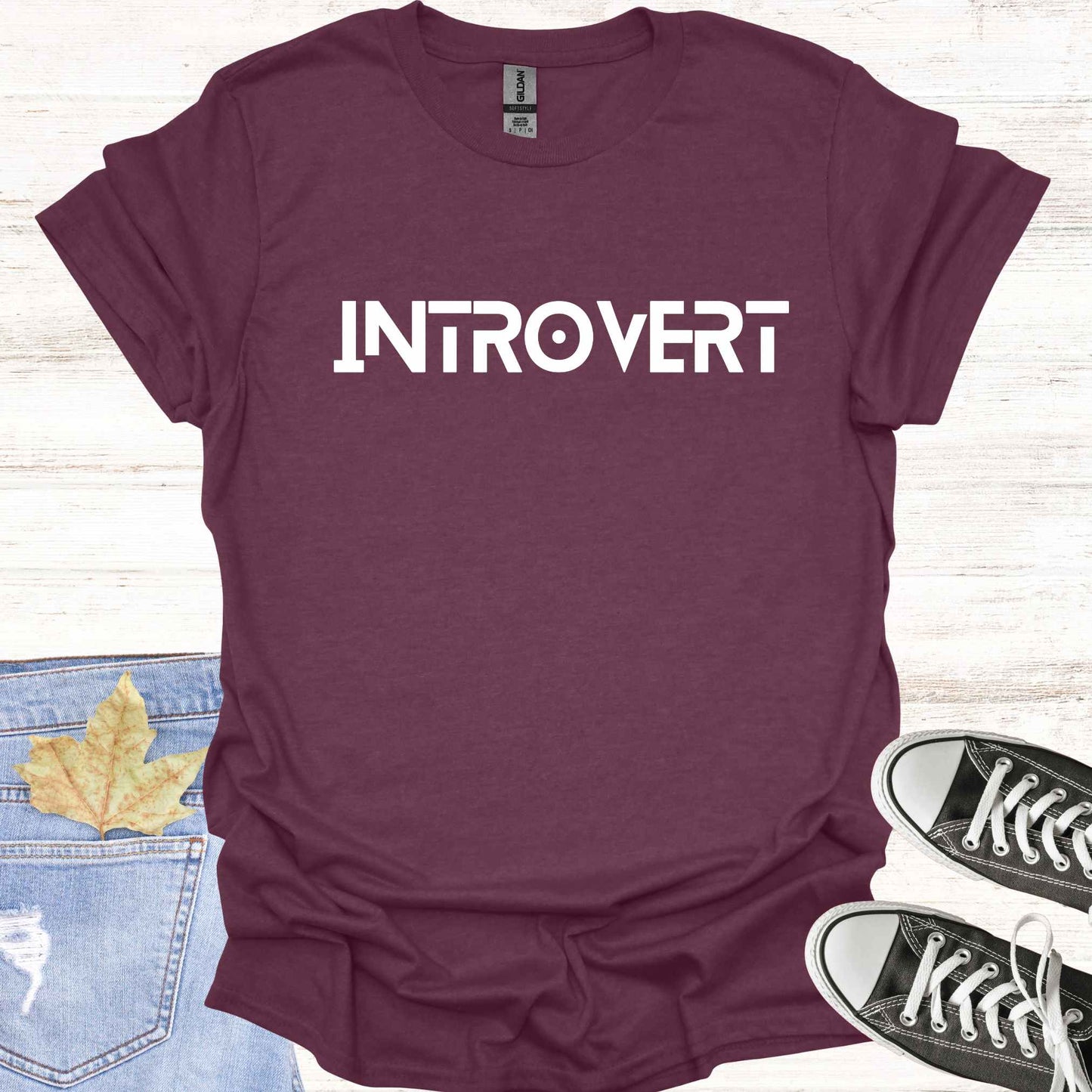 Maroon purple t-shirt featuring the word 'INTROVERT' in bold, striking lettering. This minimalist design celebrates introversion and resonates with individuals who value solitude, introspection, and quiet strength. Perfect for those who embrace their introverted nature with confidence and pride.