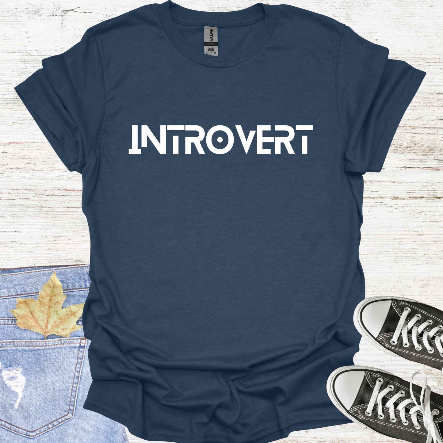 Navy blue t-shirt featuring the word 'INTROVERT' in bold, striking lettering. This minimalist design celebrates introversion and resonates with individuals who value solitude, introspection, and quiet strength. Perfect for those who embrace their introverted nature with confidence and pride.