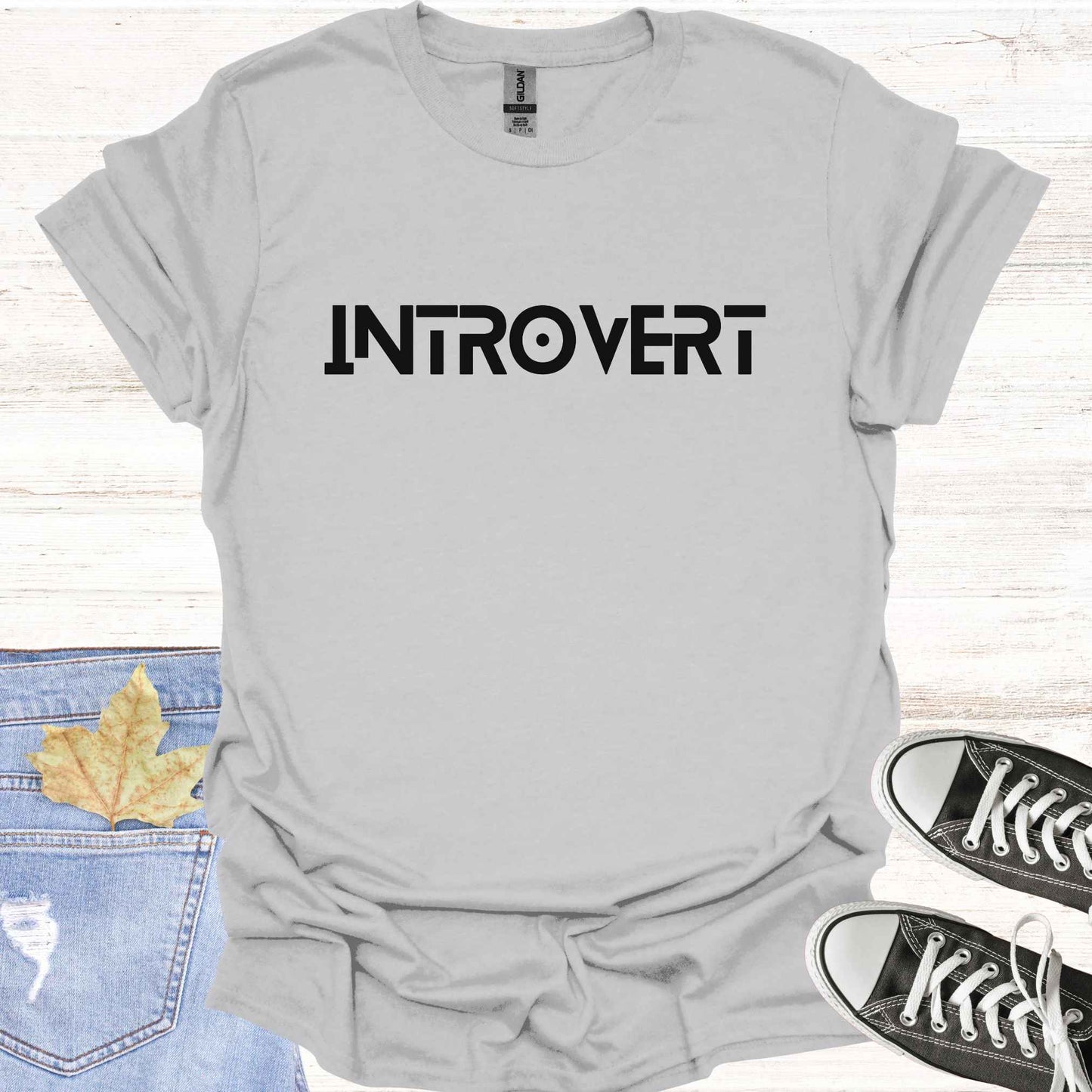Grey t-shirt featuring the word 'INTROVERT' in bold, striking lettering. This minimalist design celebrates introversion and resonates with individuals who value solitude, introspection, and quiet strength. Perfect for those who embrace their introverted nature with confidence and pride.