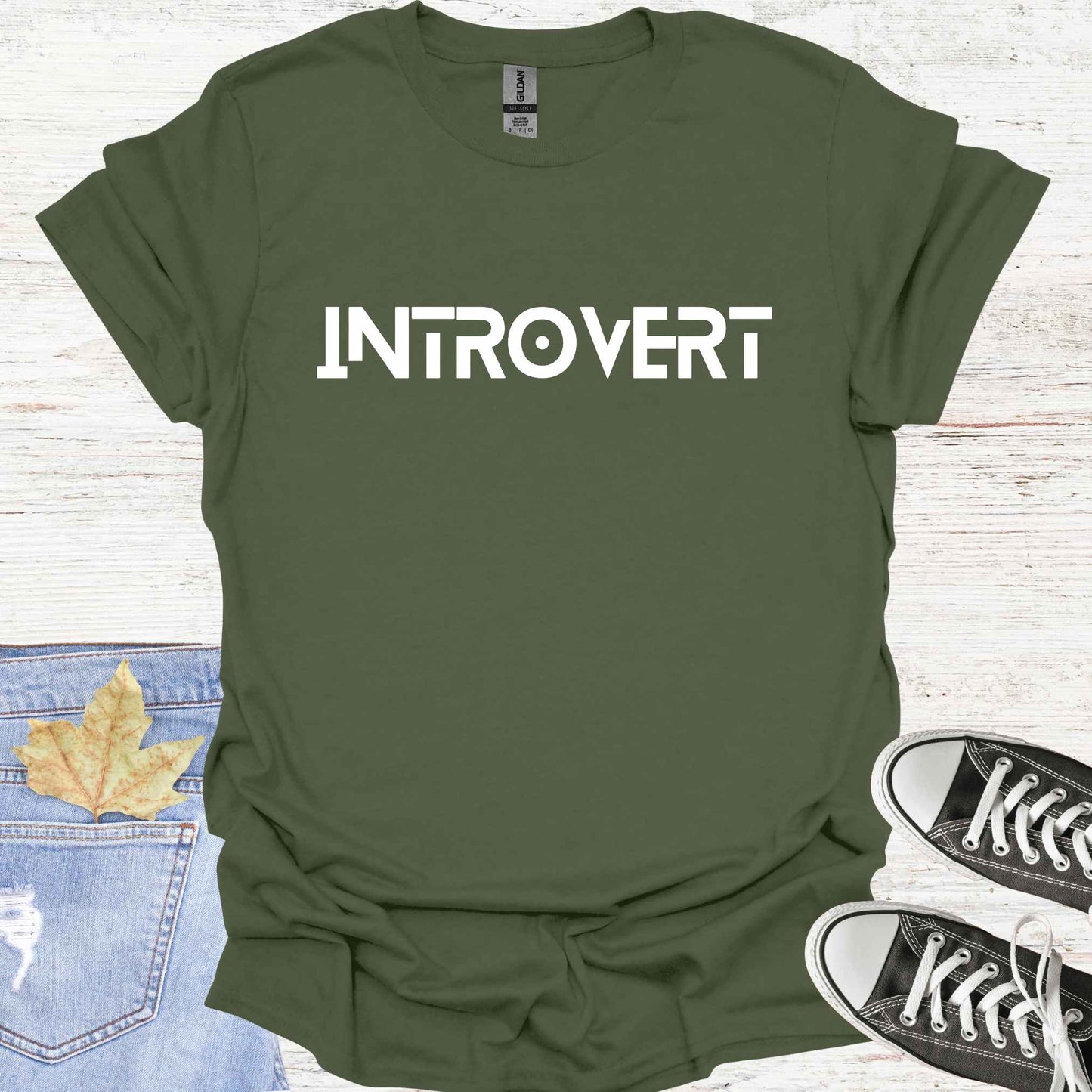 Military green t-shirt featuring the word 'INTROVERT' in bold, striking lettering. This minimalist design celebrates introversion and resonates with individuals who value solitude, introspection, and quiet strength. Perfect for those who embrace their introverted nature with confidence and pride.