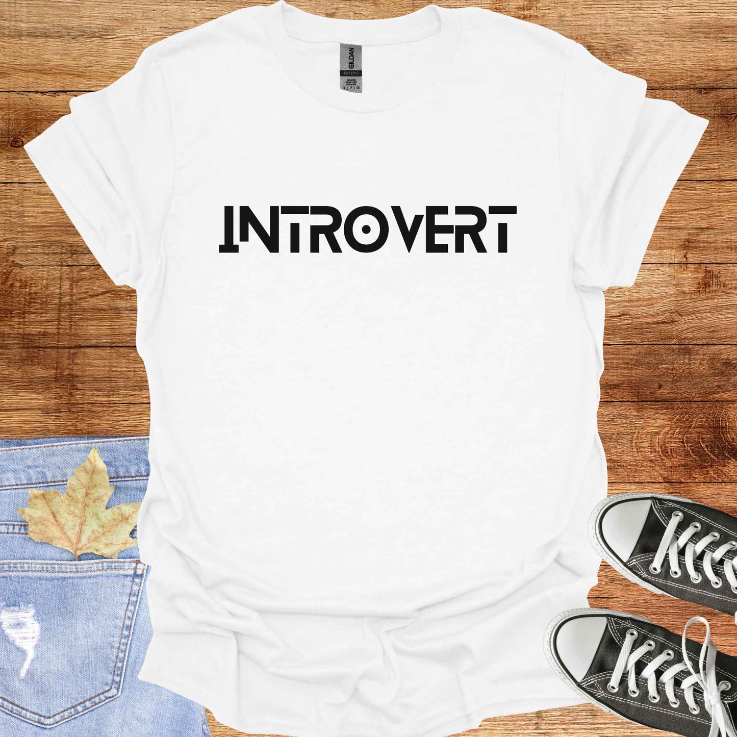 White t-shirt featuring the word 'INTROVERT' in bold, striking lettering. This minimalist design celebrates introversion and resonates with individuals who value solitude, introspection, and quiet strength. Perfect for those who embrace their introverted nature with confidence and pride.