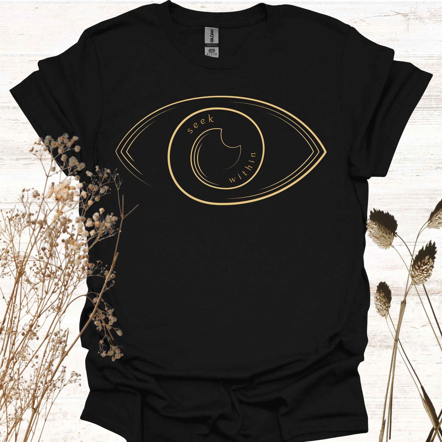 A black t-shirt featuring a line graphic of an eye, with the phrase "Seek Within" placed inside. This design emphasizes the spiritual teaching that truth, peace, and self-realization can be found within one's own consciousness. Inspired by non-duality and self-reflection, it is ideal for spiritual seekers, meditators, and those drawn to introspection and inner wisdom.