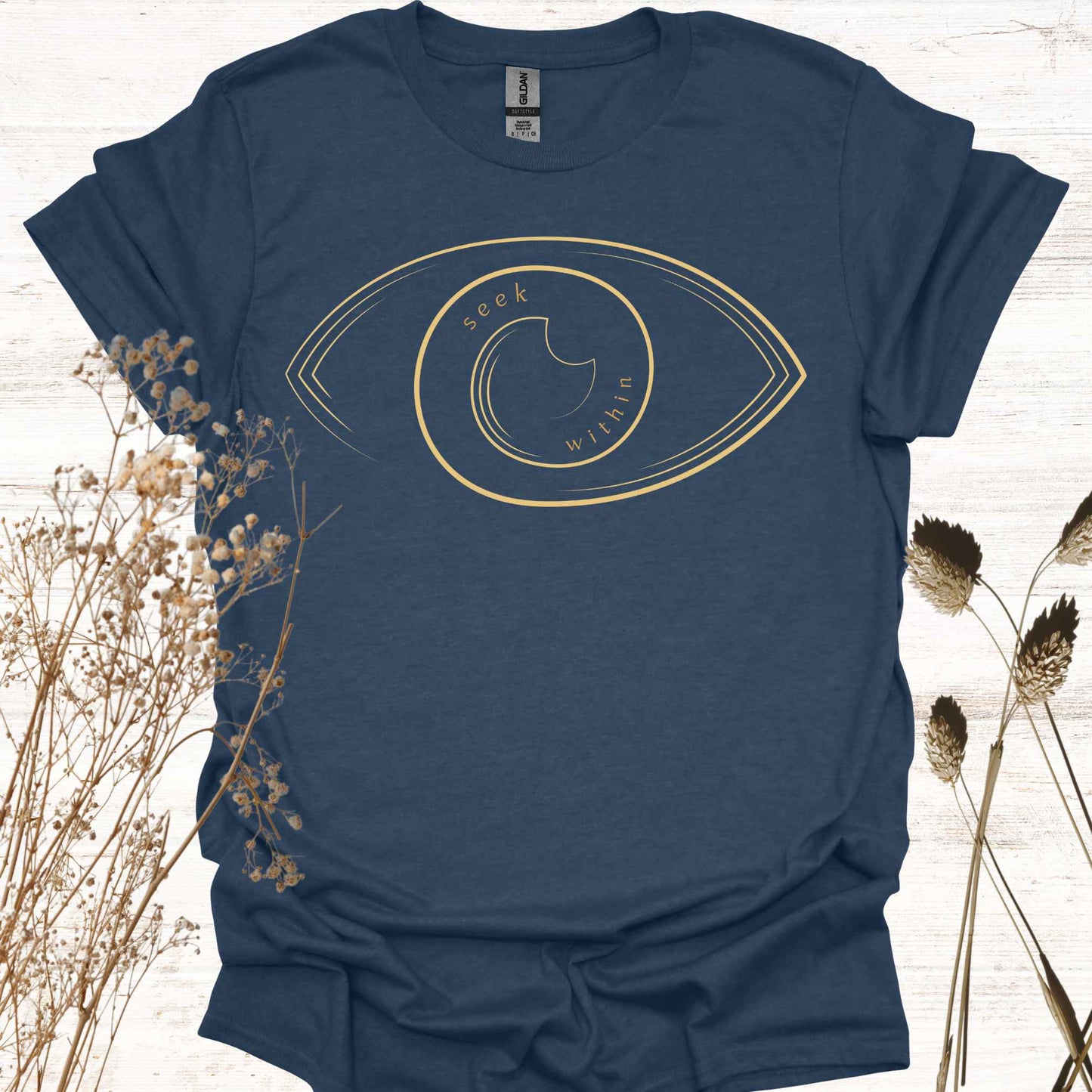 A t-shirt featuring a line graphic of an eye, with the phrase "Seek Within" placed inside. This design emphasizes the spiritual teaching that truth, peace, and self-realization can be found within one's own consciousness. Inspired by non-duality and self-reflection, it is ideal for spiritual seekers, meditators, and those drawn to introspection and inner wisdom.